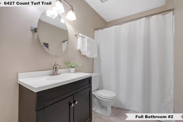 6427 Count Turf Trl, Tallahassee, FL 32309 - bathroom featuring vanity, toilet, and tile patterned flooring
