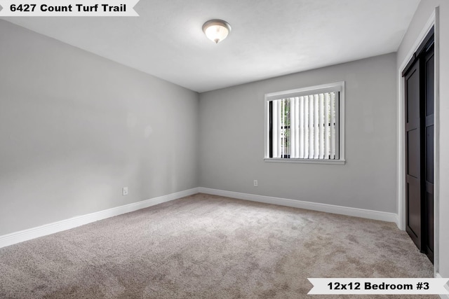 6427 Count Turf Trl, Tallahassee, FL 32309 - unfurnished bedroom featuring carpet flooring, baseboards, and a closet