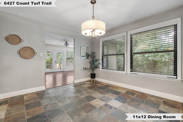 6427 Count Turf Trl, Tallahassee, FL 32309 - unfurnished room featuring stone tile flooring, baseboards, a chandelier, and ceiling fan
