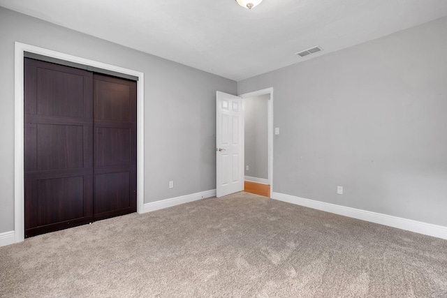 6427 Count Turf Trl, Tallahassee, FL 32309 - unfurnished bedroom featuring carpet flooring, a closet, and baseboards