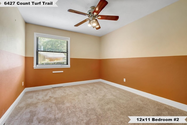 6427 Count Turf Trl, Tallahassee, FL 32309 - spare room with carpet floors, a ceiling fan, and baseboards