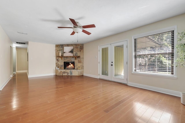 6427 Count Turf Trl, Tallahassee, FL 32309 - unfurnished living room featuring a ceiling fan, light wood-style flooring, and french doors