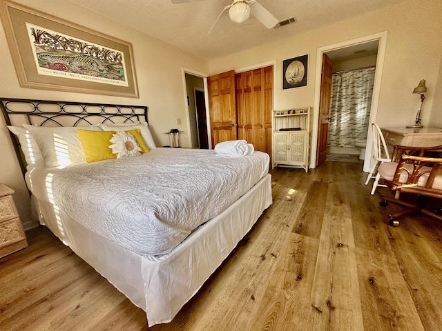 1268 Alligator Dr, Alligator Point, FL 32346 - bedroom featuring wood finished floors, a closet, and a ceiling fan
