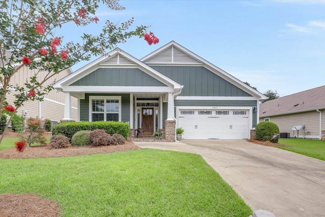 2642 Opequon Bnd, Tallahassee, FL 32312 - craftsman inspired home with board and batten siding, a front lawn, driveway, and an attached garage