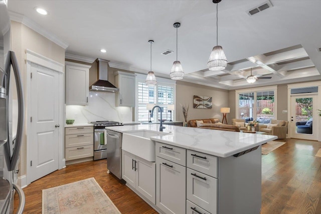 2642 Opequon Bnd, Tallahassee, FL 32312 - kitchen with wall chimney range hood, appliances with stainless steel finishes, open floor plan, healthy amount of natural light, and crown molding