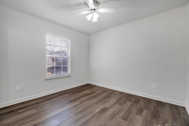 unfurnished room with dark wood-type flooring, a textured ceiling, and ceiling fan