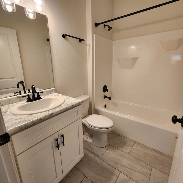 full bathroom with bathtub / shower combination, tile patterned floors, vanity, and toilet