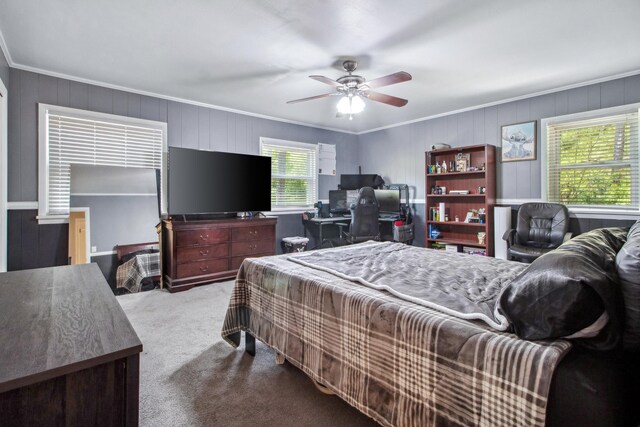 bedroom with carpet floors, crown molding, and ceiling fan