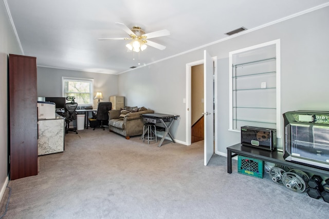 living area featuring crown molding, carpet, baseboards, ceiling fan, and visible vents