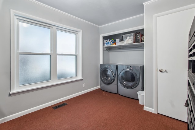 laundry area featuring dark colored carpet, baseboards, visible vents, washer and dryer, and laundry area