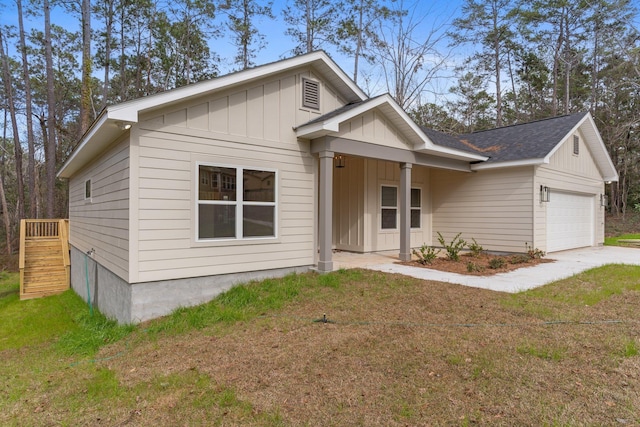 view of front of home with a garage and a front yard