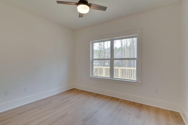 empty room featuring light wood-type flooring and ceiling fan