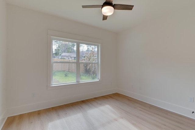 spare room with ceiling fan and light hardwood / wood-style flooring