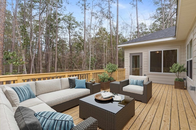 wooden terrace with an outdoor hangout area