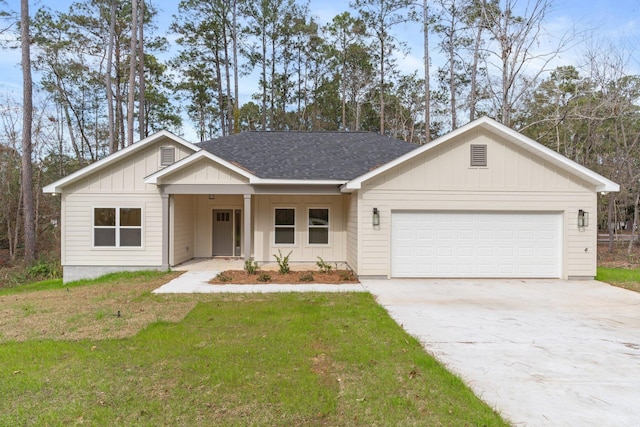 ranch-style home featuring a front yard and a garage