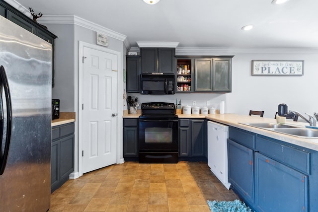 kitchen featuring black appliances, ornamental molding, sink, and blue cabinetry