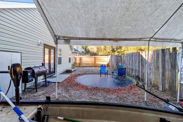 view of patio featuring a grill and french doors