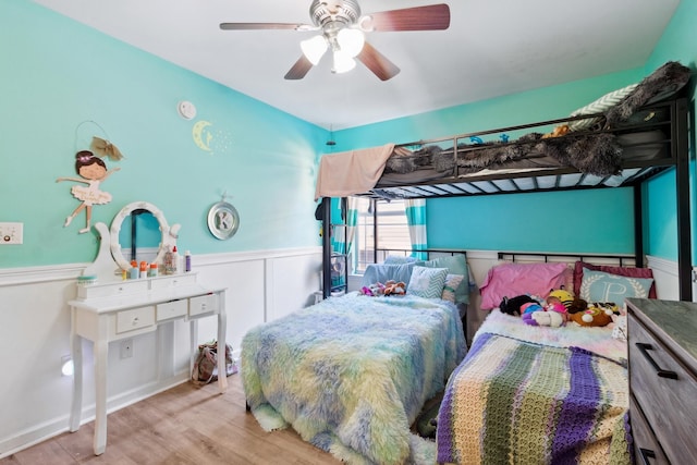 bedroom with light hardwood / wood-style floors and ceiling fan