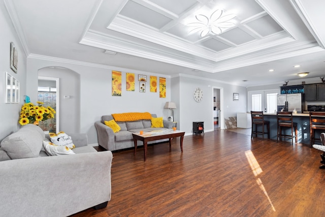 living room featuring a wood stove, crown molding, dark hardwood / wood-style flooring, and coffered ceiling