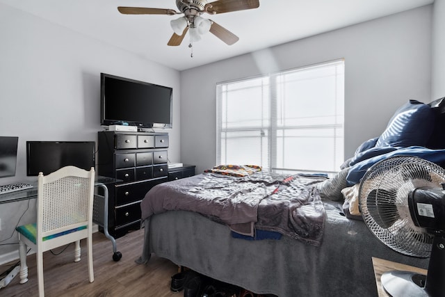 bedroom with ceiling fan and hardwood / wood-style floors