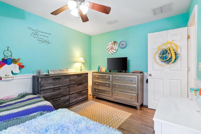 bedroom featuring light hardwood / wood-style flooring and ceiling fan