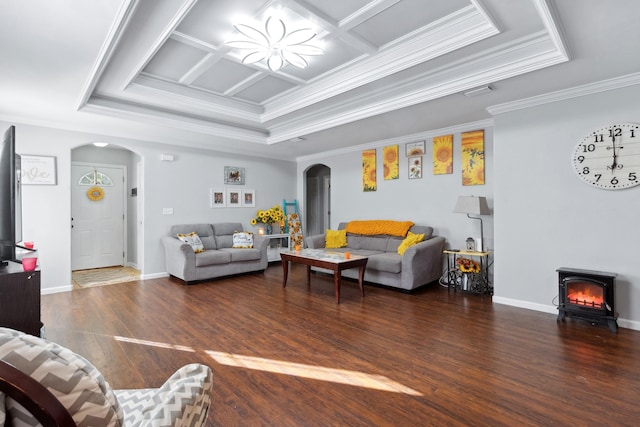 living room featuring a wood stove, dark wood-type flooring, coffered ceiling, a raised ceiling, and crown molding