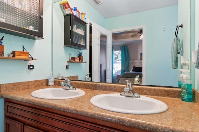 bathroom featuring vanity and ceiling fan