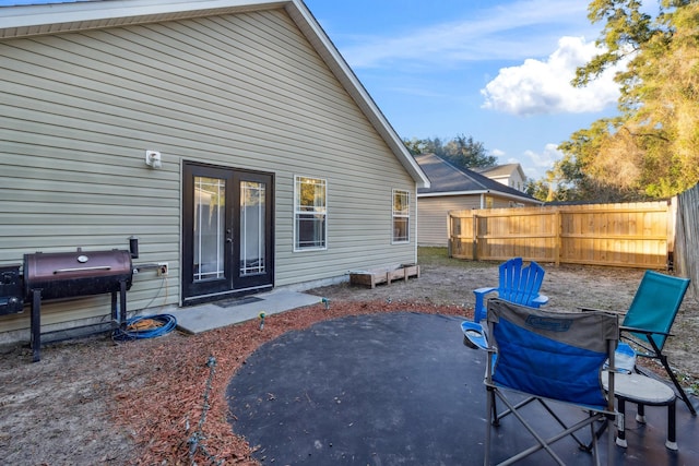 rear view of house with a patio area and french doors