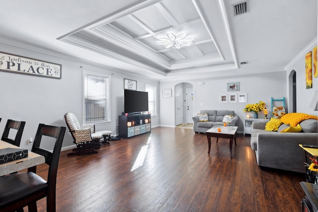 living room featuring dark hardwood / wood-style floors, a raised ceiling, and ornamental molding