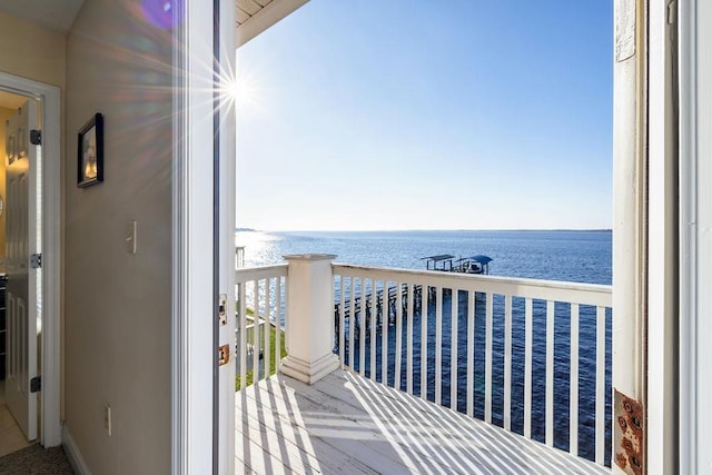 balcony featuring a water view