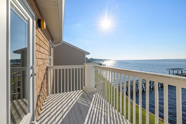 balcony with a beach view and a water view