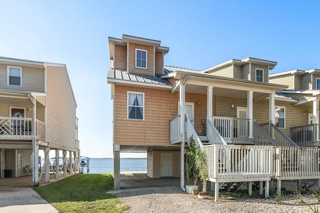 view of front facade featuring a porch and a water view