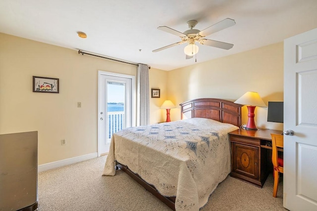 carpeted bedroom featuring ceiling fan and access to exterior