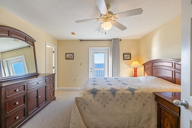 bedroom featuring light carpet, access to outside, and ceiling fan