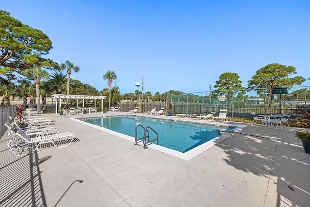 view of swimming pool with a patio area and a pergola