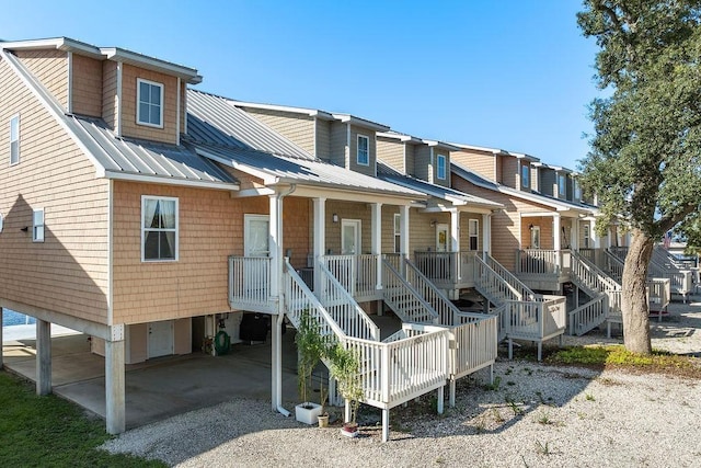 rear view of property with a porch