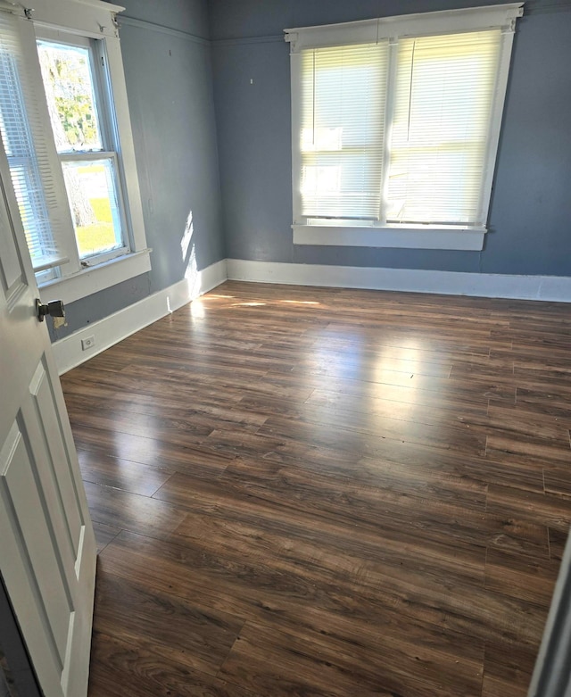 empty room featuring dark wood-type flooring