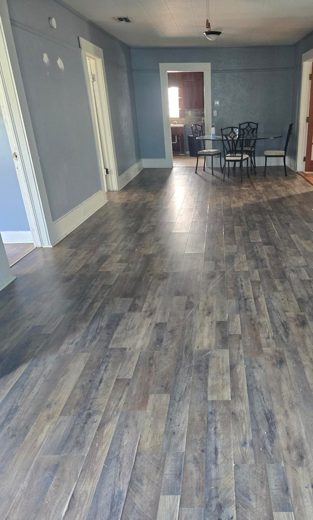 unfurnished dining area with dark hardwood / wood-style flooring