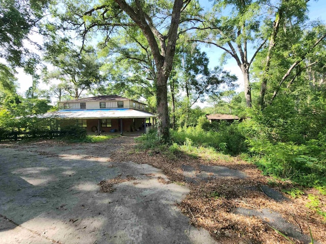 5490 Jackson Bluff Rd, Tallahassee, FL 32310 - view of yard with a carport and driveway