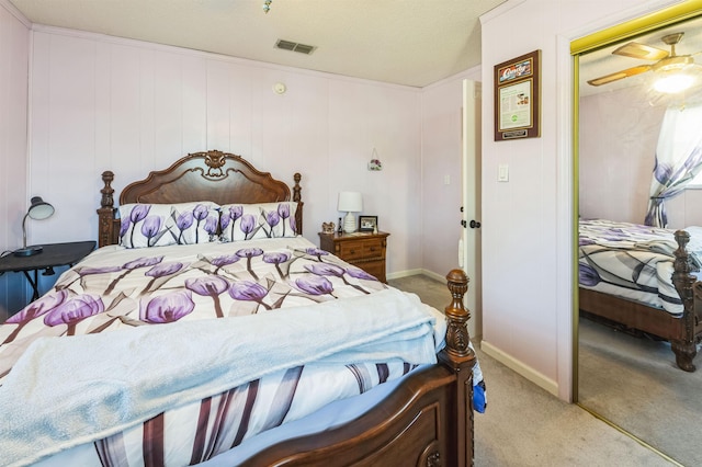 carpeted bedroom featuring a closet