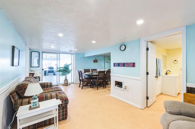 living room featuring sink and expansive windows