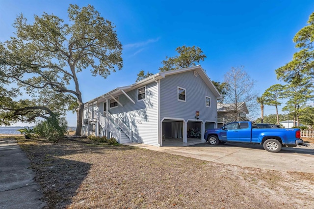 view of side of home with a garage