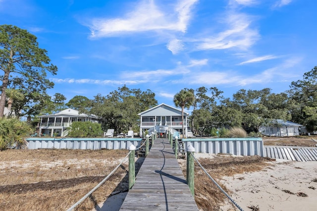 rear view of property with a sunroom