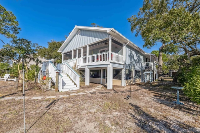 back of property with a sunroom