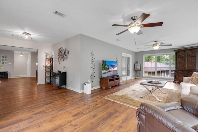 5313 Ben Brush Trl, Tallahassee, FL 32309 - living area featuring wood finished floors, ceiling fan, and baseboards