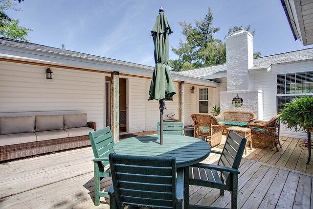 deck featuring outdoor lounge area