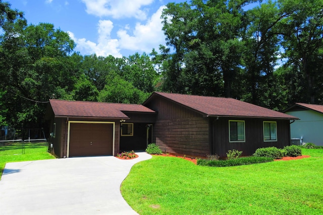 5491 Denargo Dr, Tallahassee, FL 32303 - view of front of home with a garage, driveway, and a front lawn