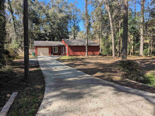 ranch-style home featuring a garage