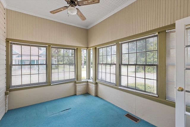 315 W Green St, Perry, FL 32347 - unfurnished sunroom featuring carpet floors, plenty of natural light, and crown molding