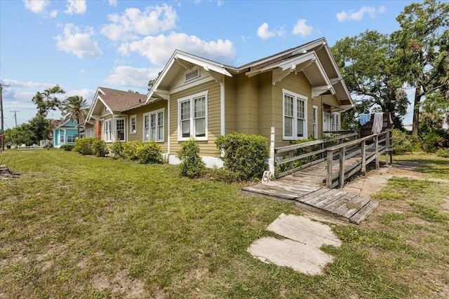 315 W Green St, Perry, FL 32347 - view of property exterior with a yard